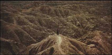 Sarah, standing in the center of the Badlands